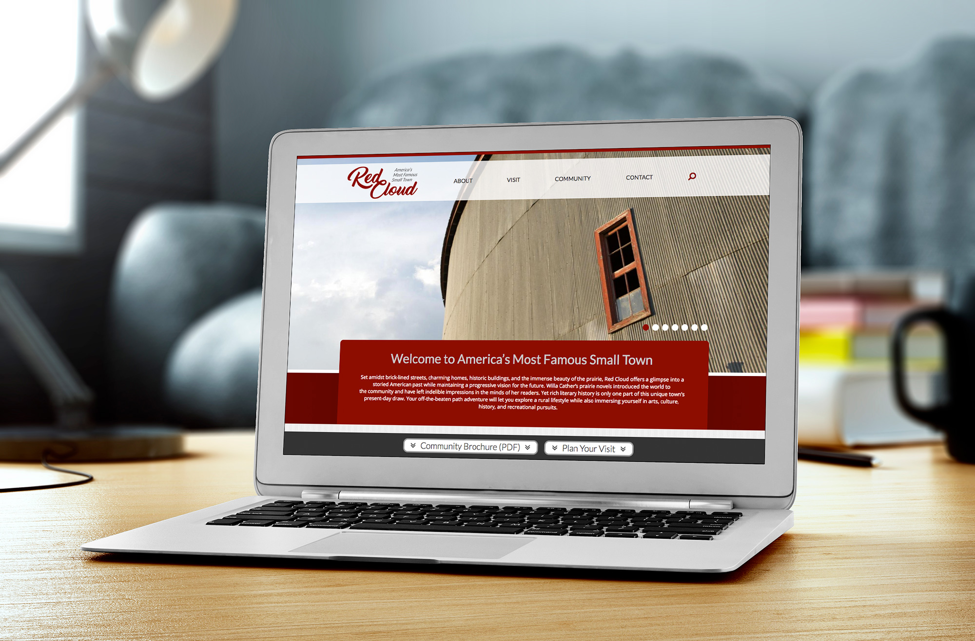 red cloud community website design on laptop