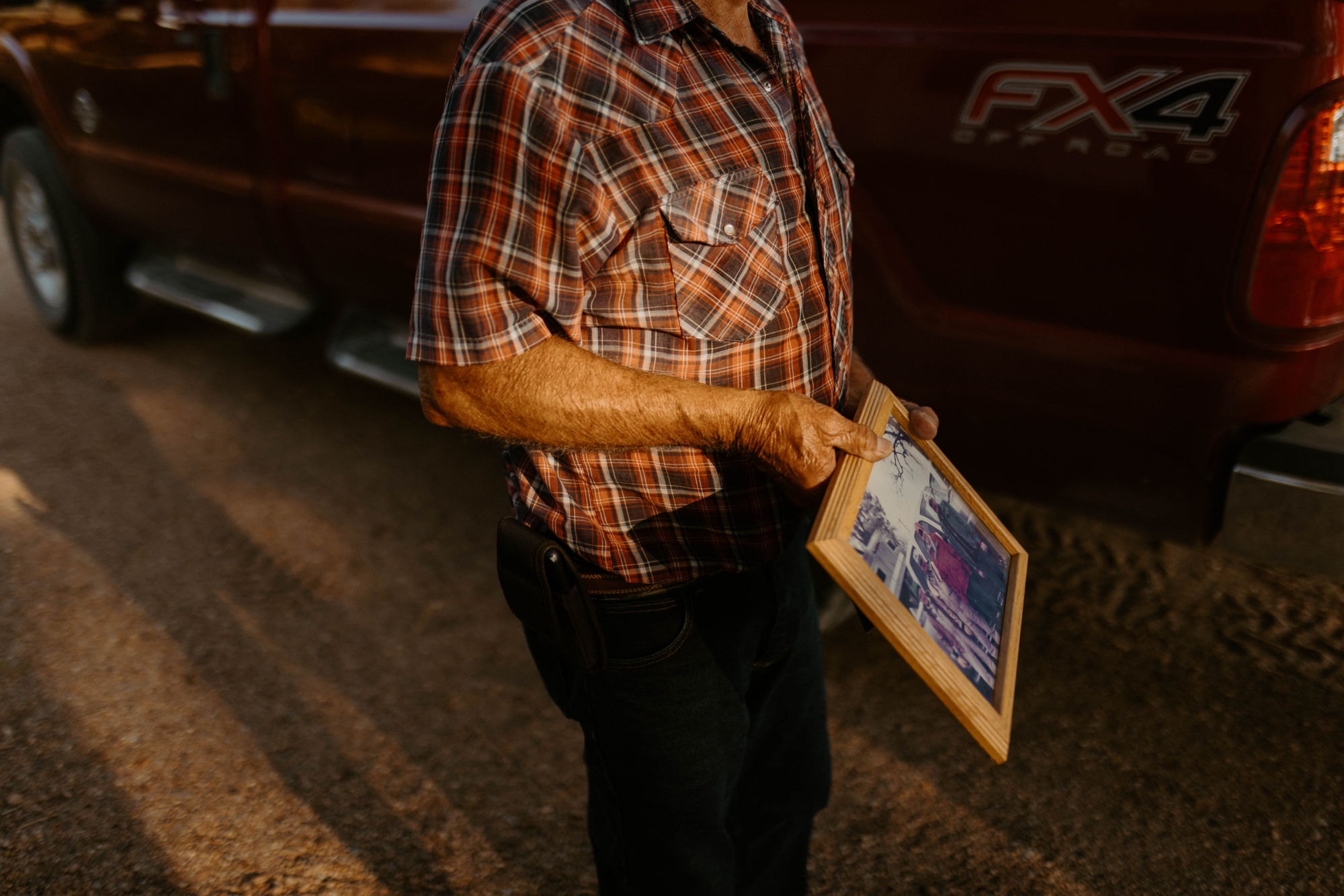 farmer holding a photo