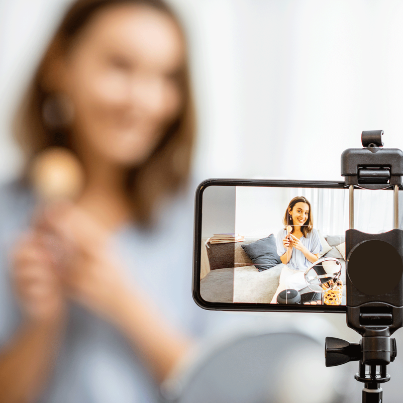 woman filming video at home