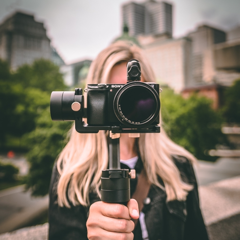 woman holding video camera