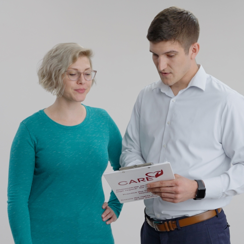 two people looking at a chart