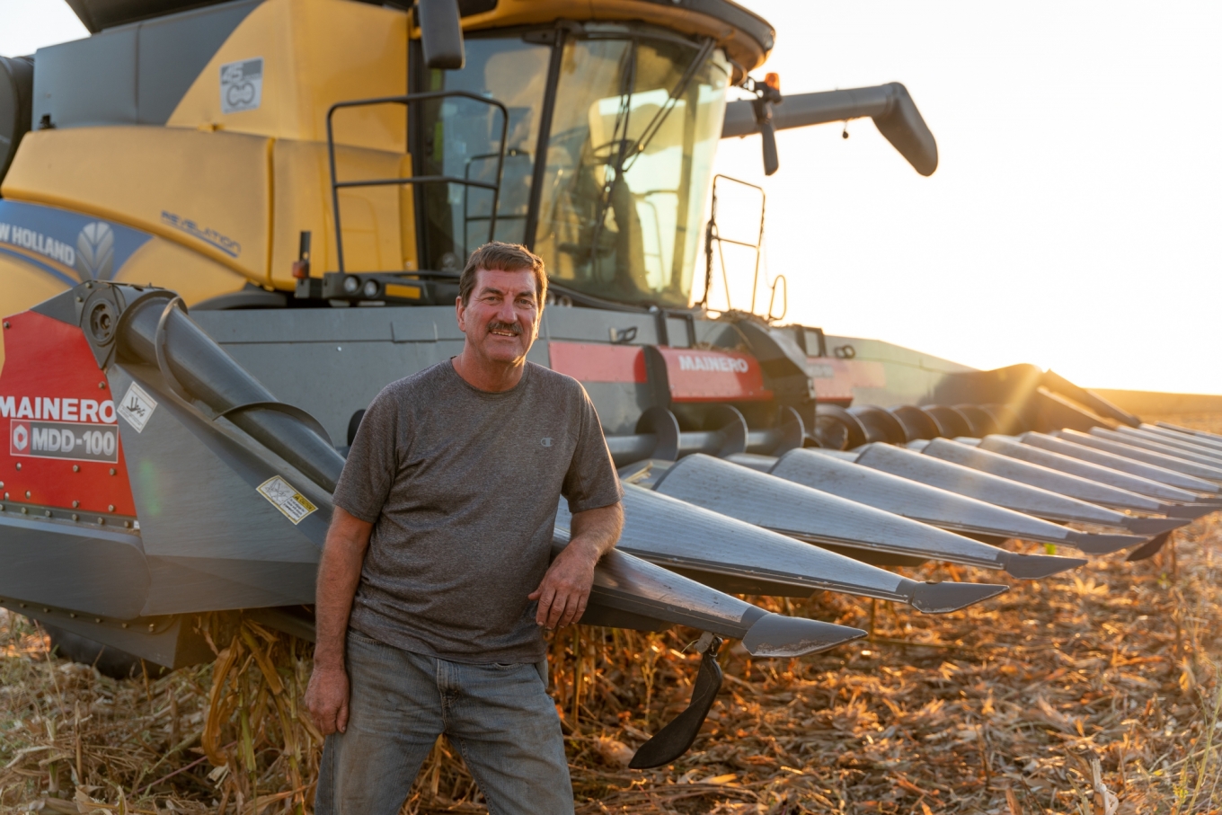 agriculture video farmer standing by tractor