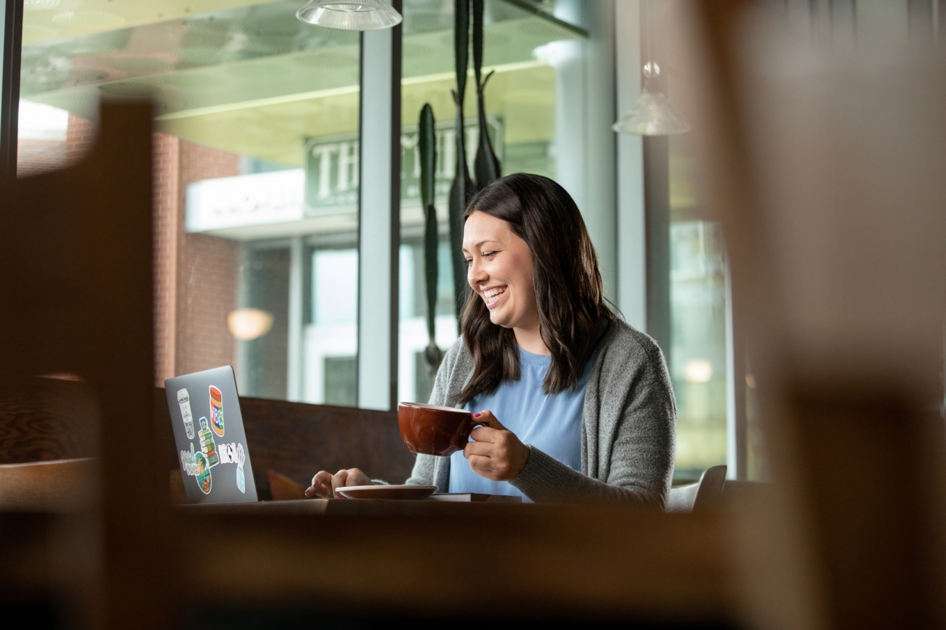 Woman smiling at laptop