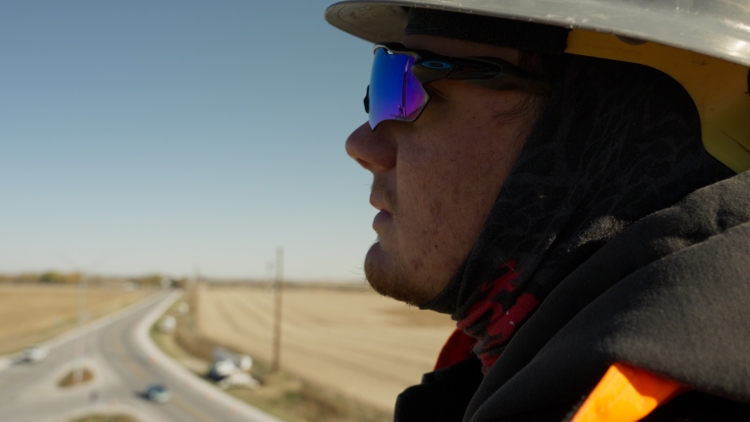 Electrician looking over powerlines