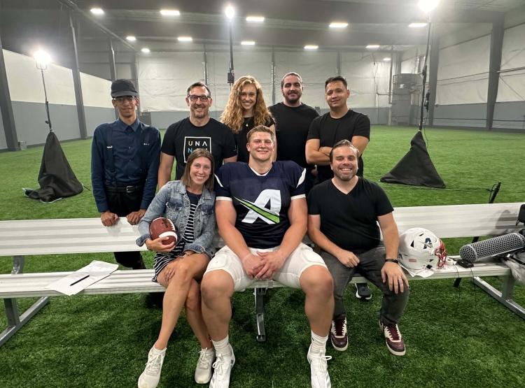 Crew taking wrap photo following successful shoot