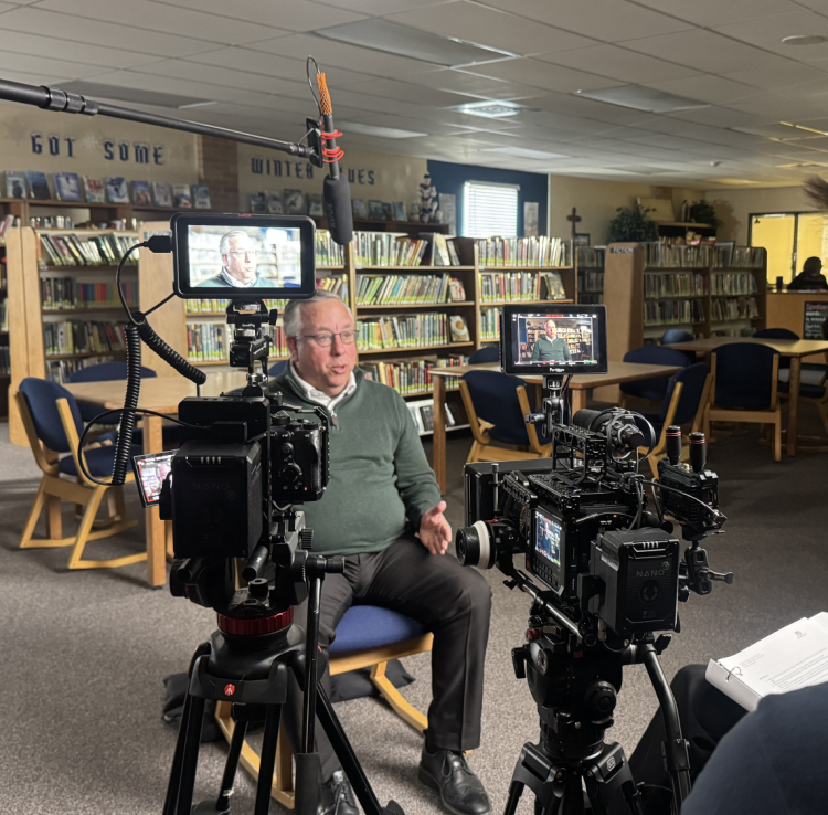 Man sitting down for interview