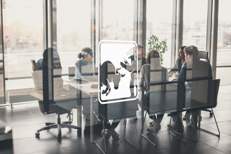Partners and clients sitting in conference room
