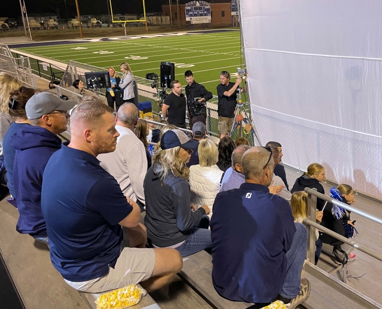 Crew setting up football fan scene
