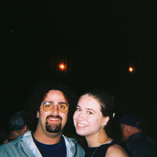 Graphic Designer, Emily Bray, and her fiance at a concert