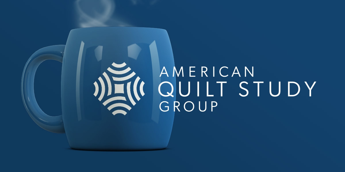 american quilt study group logo on blue mug