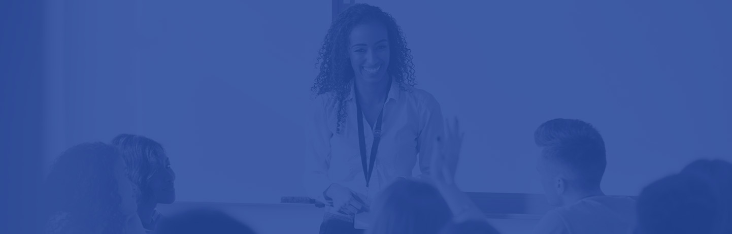 Blue gradient over an image of an educator and students