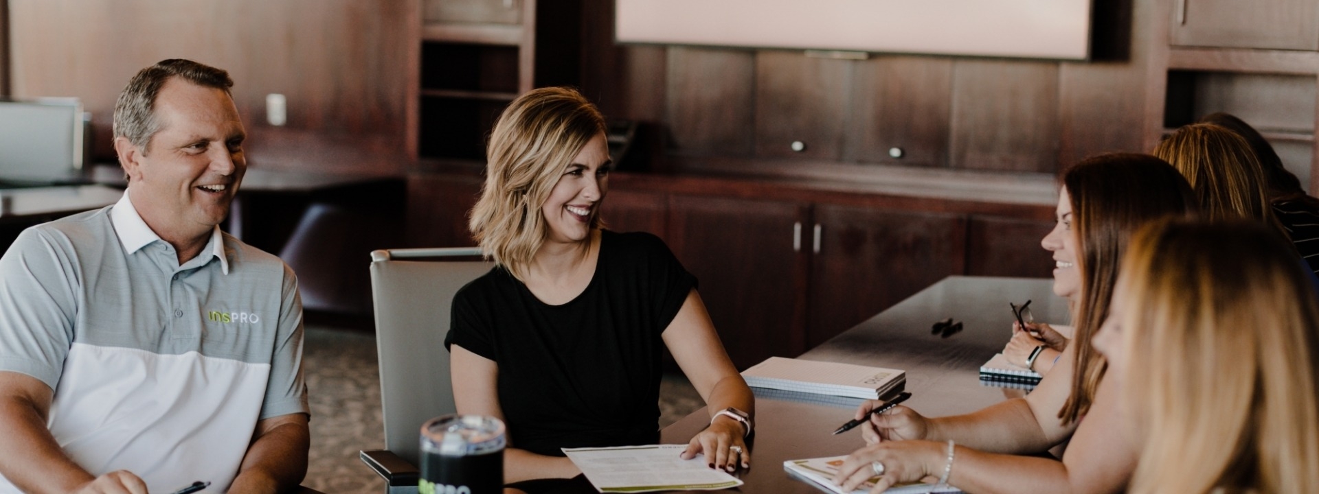 team reviewing insurance plans